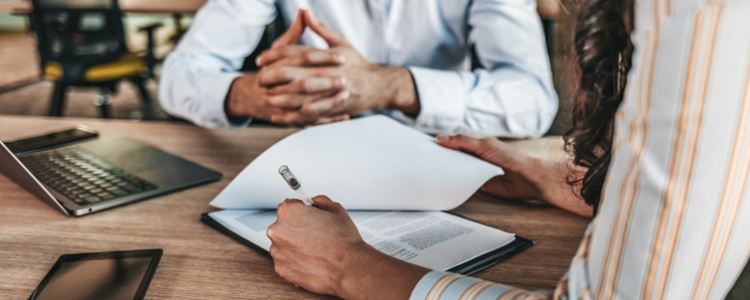 attorney for divorce near syracuse ny couple signing divorce papers